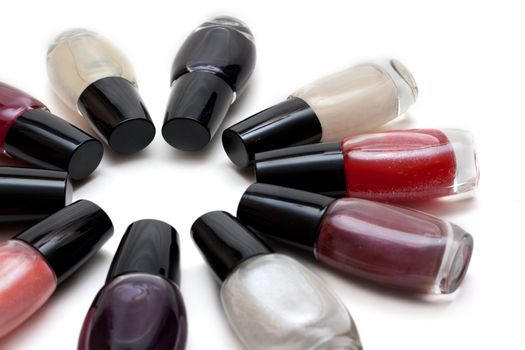 Vials colour varnish nailwaer, make-up insulated on white background