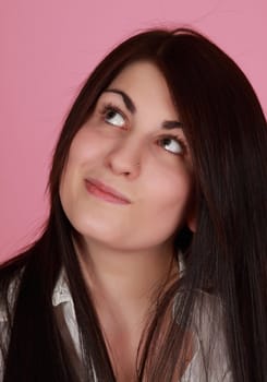 closeup portrait of caucasian girl, pink background
