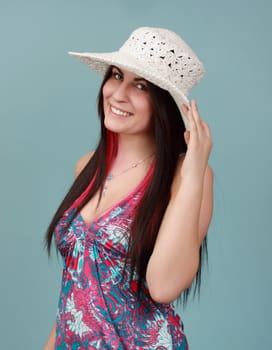 caucasian girl with white hat, blue background