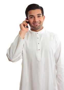 Smiling ethnic business man using a mobile phone and in traditional ethnic robe - Kurta - fastened with ruby buttons. The name Kurta is a borrowing from Urdu and Hindi,and originally from Persian (literally, "a collarless shirt").