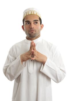 Man wearing kurta robe and topi cultural clothing - thinking and looking up.   White background.