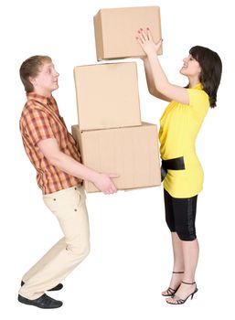 Girl loads the young man with cardboard boxes