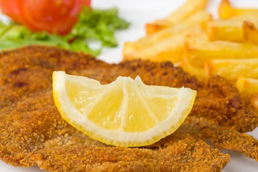 detail of a viennese schnitzel on a plate