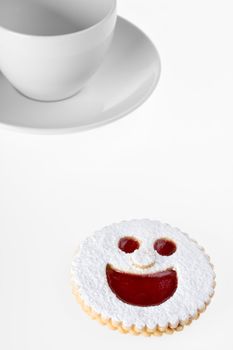 smiling cookie and a coffee cup isolated on white background