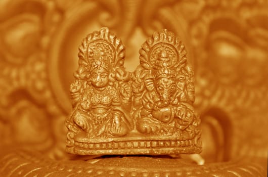 A clay lamp with idols of Lord Ganesh (Elephant God) and Goddess Laxmi, for worshipping in Diwali festival.