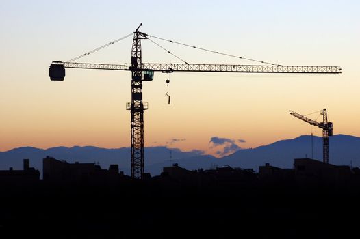Building under construction - silhouette in the orange sunset