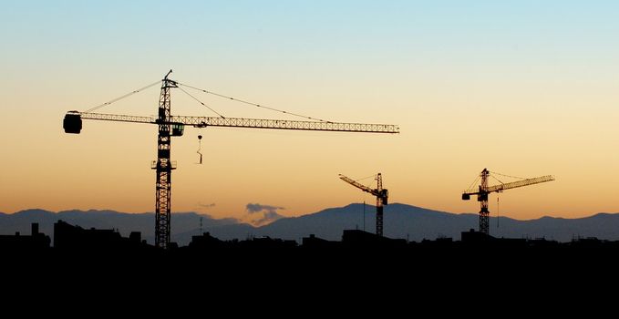 Building under construction - silhouette in the orange sunset