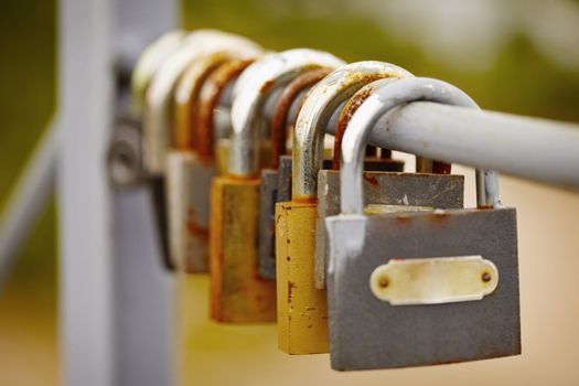 Old padlocks left by the bride and groom on bridge