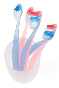 Colored toothbrush in glass. With clipping path.
