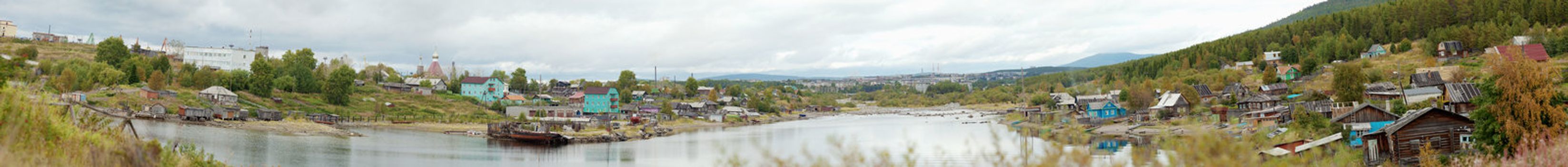 Panorama of the countryside with the river and the church