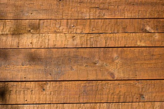 Facing of wooden boards of a wall. Side of an old alpine refuge