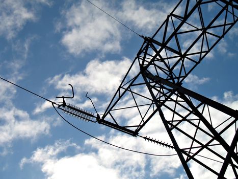 A silhouette of an hydroelectric high-voltage electrical line in mountain