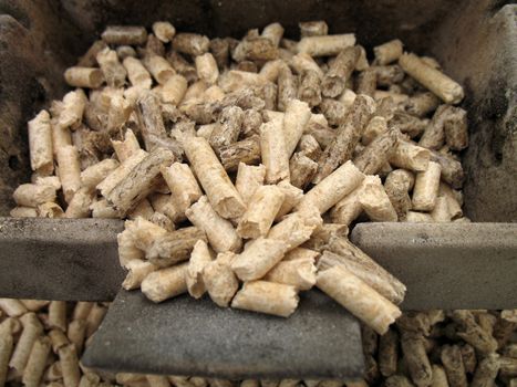 wood pellets for fireplaces and stoves in a crucible