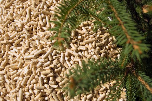 wood pellets green energy and branches of red deal