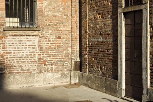 A corner of an old building made of red bricks