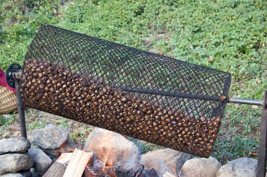 A traditional cylinder to roast chestnuts on the fire