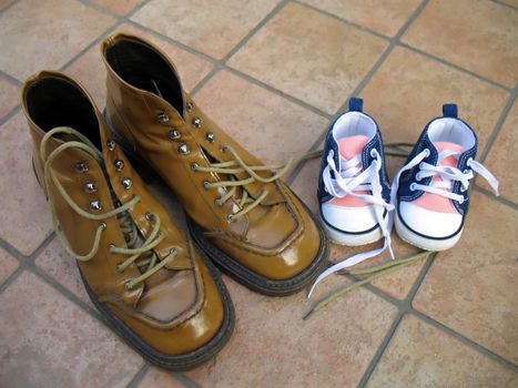 A pair of shoes for the mother and a pair for the little daughter