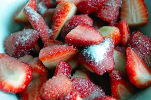 close up of strawberries with white sugar 