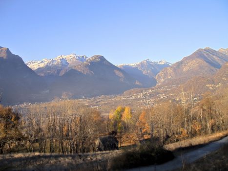 A panorama of Ossola Valley. Mountains in fall season with the first snow, Italy, HDR