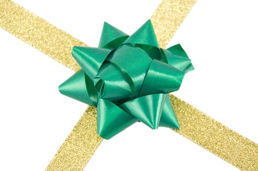 Christmas decoration golden ribbon with green bow isolated on white