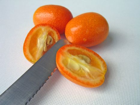 cutting tangerines (kumquat), knife