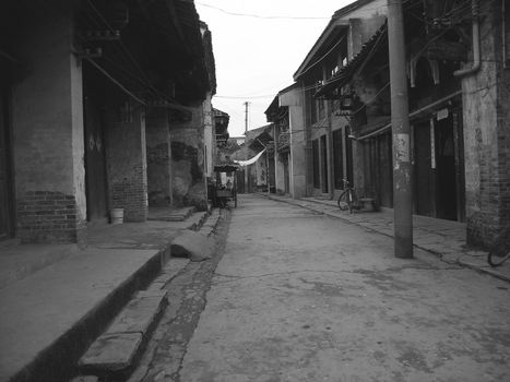 empty, narrow street in a small village