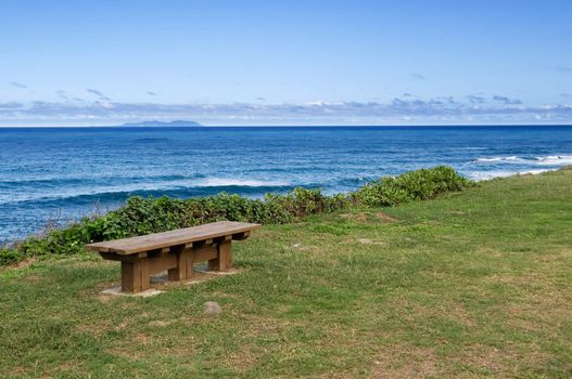 It is a chair near the beautiful sea.