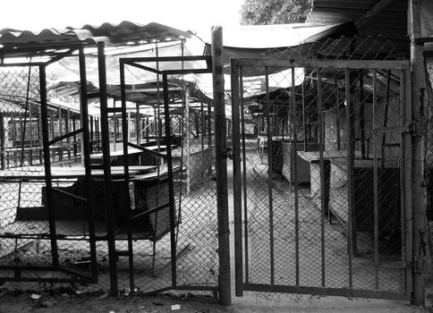 empty, abandoned marketplace with ruined stalls
