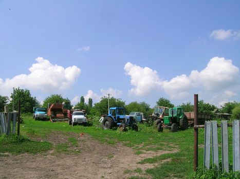 old, ruined tractors and trucks
