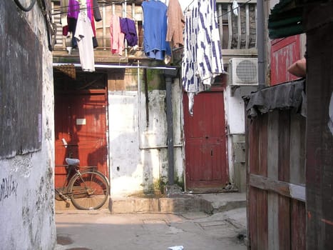 empty, narrow street with washing