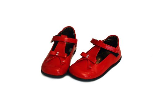 a pair of red baby shoes