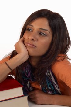 Middle eastern student in an uninterested attitude towards her books