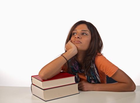 Middle eastern student in an uninterested attitude towards her books