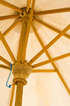 Detail of parasol, made of wood and textile.