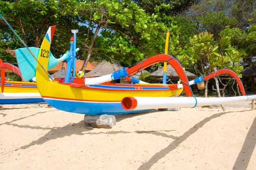 Traditional colourful fishing boats on shore, Bali, Indonesia