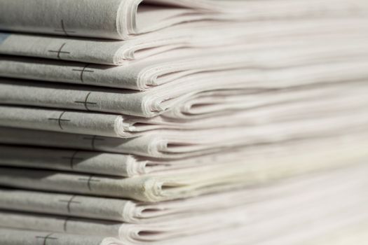 pile of newspapers on the table