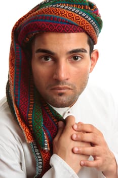 Mixed race middle eastern ethnic man wearing a robe and wovan turban keffiyeh