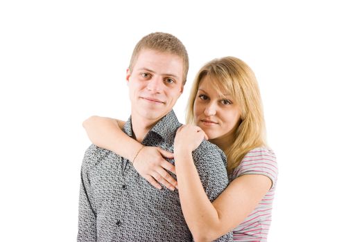 on a white background Young happy couple embracing and smiling