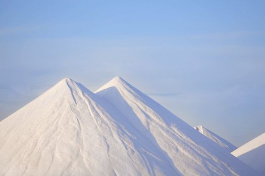 Salt mountains with blue sky at Bonaire, Caribbean