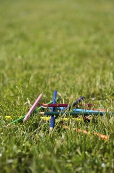 Colorful pencils on the grass 