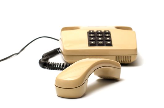 Old telephones with removed receiver isolated on a white background. 