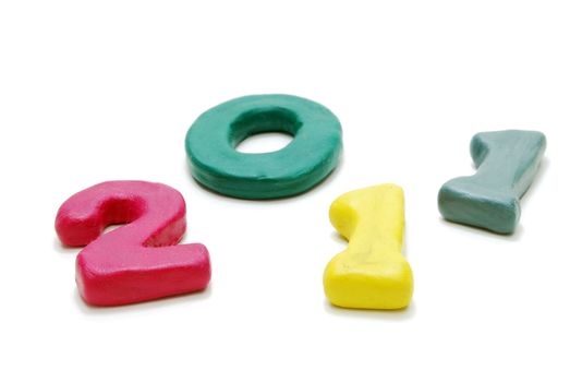3D New Year Text 2011 Laying Random Made of Colored Plasticine Isolated on White Background
