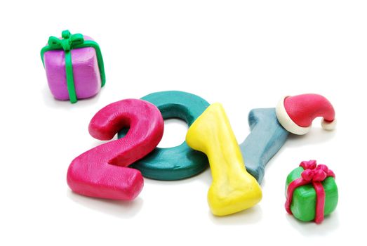 3D New Year Text 2011 Laying Random with Gifts Made of Colored Plasticine Isolated on White Background