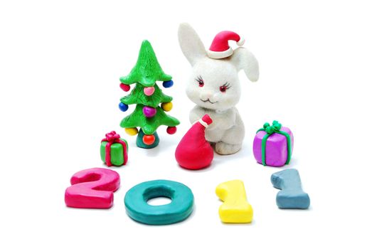 3D New Year Text 2011 Made of Colored Plasticine with Rabbit, Gifts and Christmas Tree Isolated on White Background