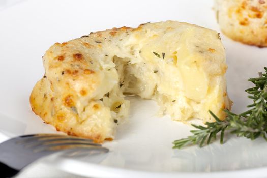 Tempting potato and cheese souffle with rosemary.