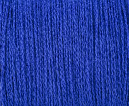 Bright blue threads ready for sewing or knitting.