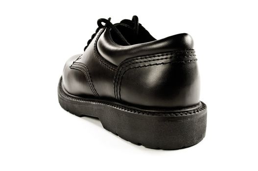 Back view of an isolated black leather shoe.