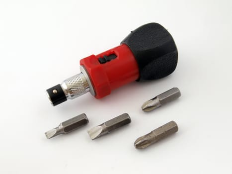 Ratchet screw  driver handle and spare bits. 