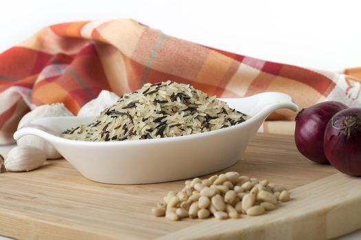 Wild rice with pine nuts and red onions.