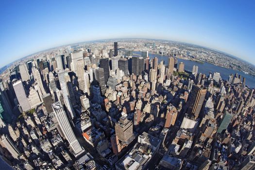 Photo of New York city taken from the Empire State Building with a fisheye lens.
